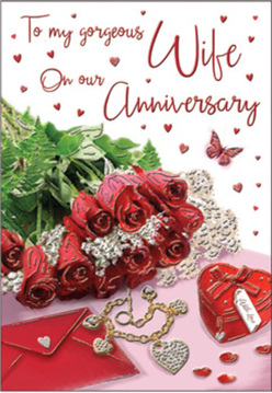 This anniversary card layout feels like a love letter set out on a bedside table in Upper Clapton, every detail placed with the quiet care of someone preparing a surprise. At the centre, a compact posy of crimson roses steals the gaze, their swirling petals so vivid and full that they appear almost touchable, like freshly delivered blooms from Flowers Upper Clapton. The flowers seem ready to spill over the edge of the card, supported by airy ferns and green fronds that lend contrast and a sense of life, their fine textures softening the bold red. Around this floral heart, romantic touches are arranged on a gentle backdrop: a deep scarlet jewellery box tied with ribbon, slightly open to hint at a hidden gift, and a golden necklace shaped into two entwined hearts, glimmering quietly in the soft light. Sparkling decorations lie scattered like tiny stars, catching reflections much like the evening glow over the River Lea. Hand-scripted text flows across the card's surface, its curves weaving through a cascade of miniature red hearts, giving the impression of spoken words drifting through the air. The light in the scene is warm and inviting, with soft highlights on each petal and piece of metal, and shadows so delicate they barely seem to exist. The entire composition feels intimate and hopeful, like a private moment shared in a home near Clapton Common-a tribute to anniversaries spent side by side, remembering the past while dreaming gently of all the days still to come.